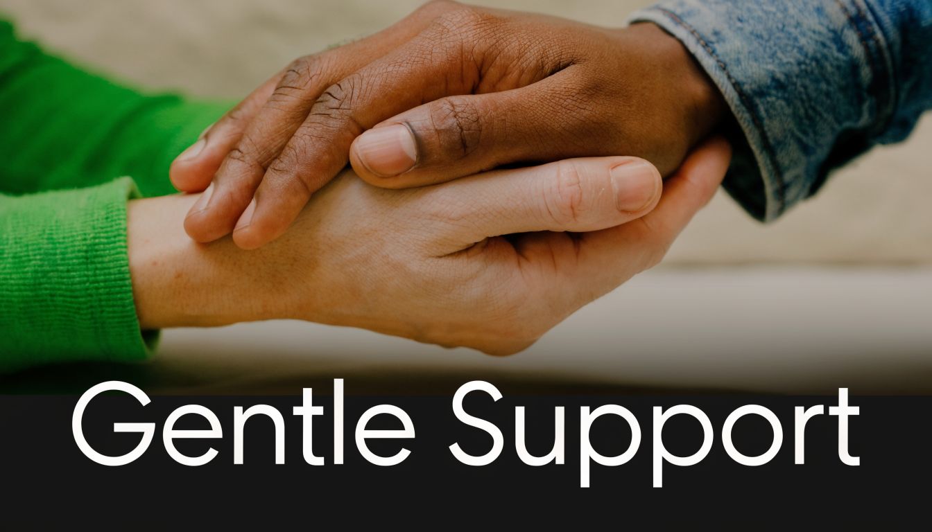 A close-up view of two people holding hands to offer comfort and gentle emotional support to one another.