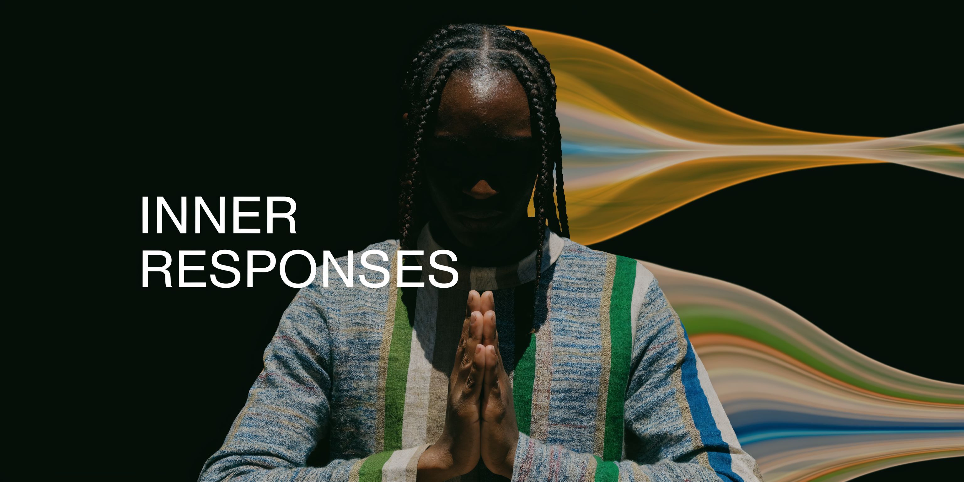 A person with braided hair and hands in a prayer pose, silhouetted against a dark, artistic background.